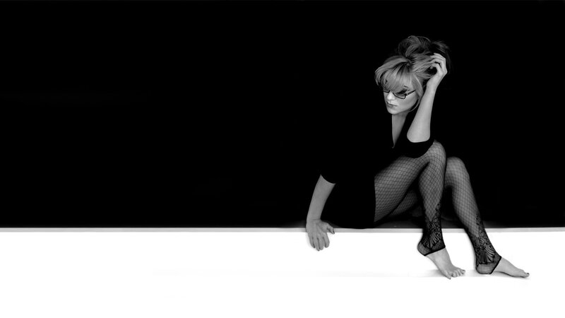 Woman in Fishnet Stockings — Black, Dramatic, Photograph, Glasses