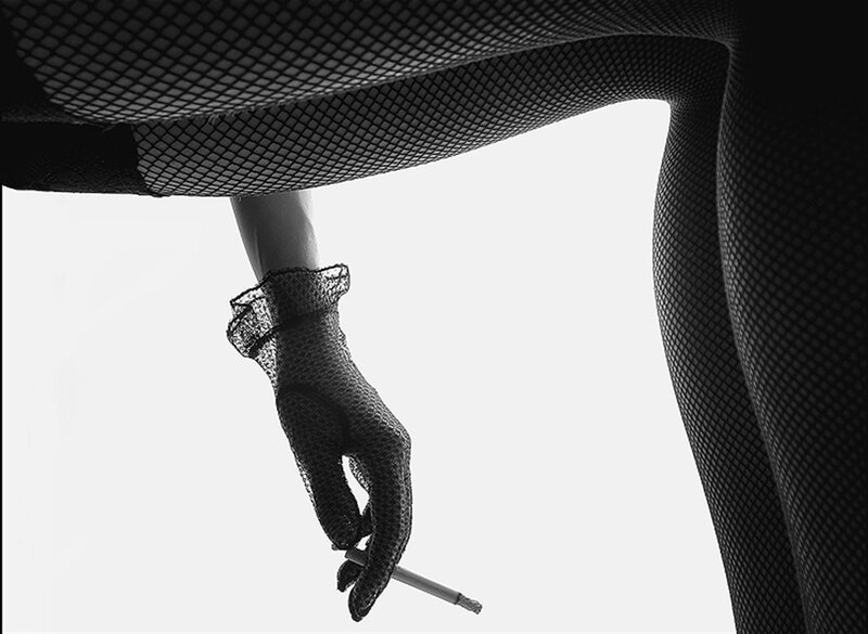 Woman in Fishnet Stockings — Black, Dramatic, Photograph, Gloved Hand