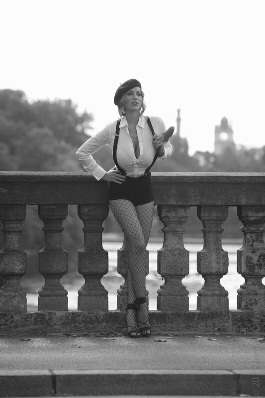 woman in fishnet stockings on bridge