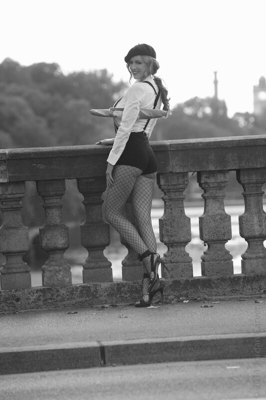woman in fishnet stockings on bridge