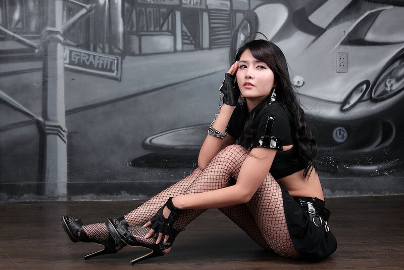 woman in fishnet stockings posing