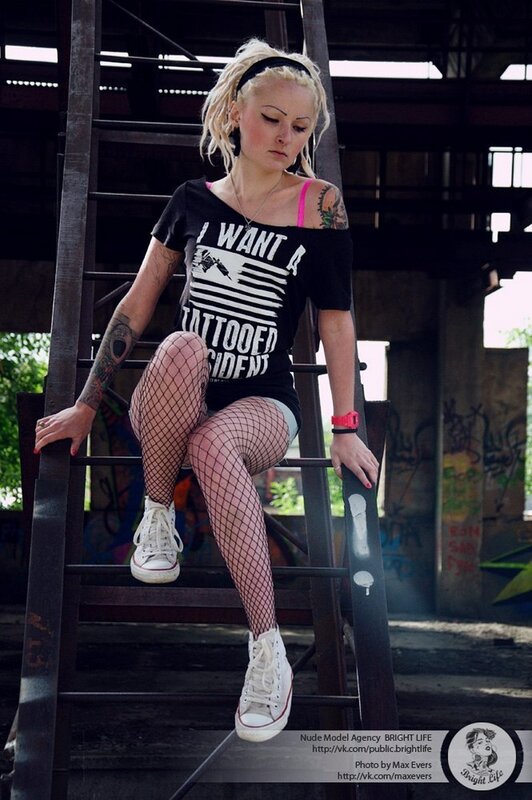 woman in fishnet tights on ladder