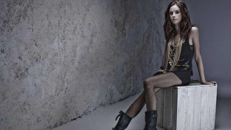 woman in fishnet tights sitting