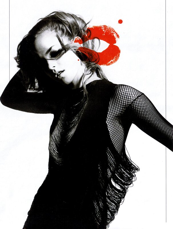 woman in fishnet top with red lips