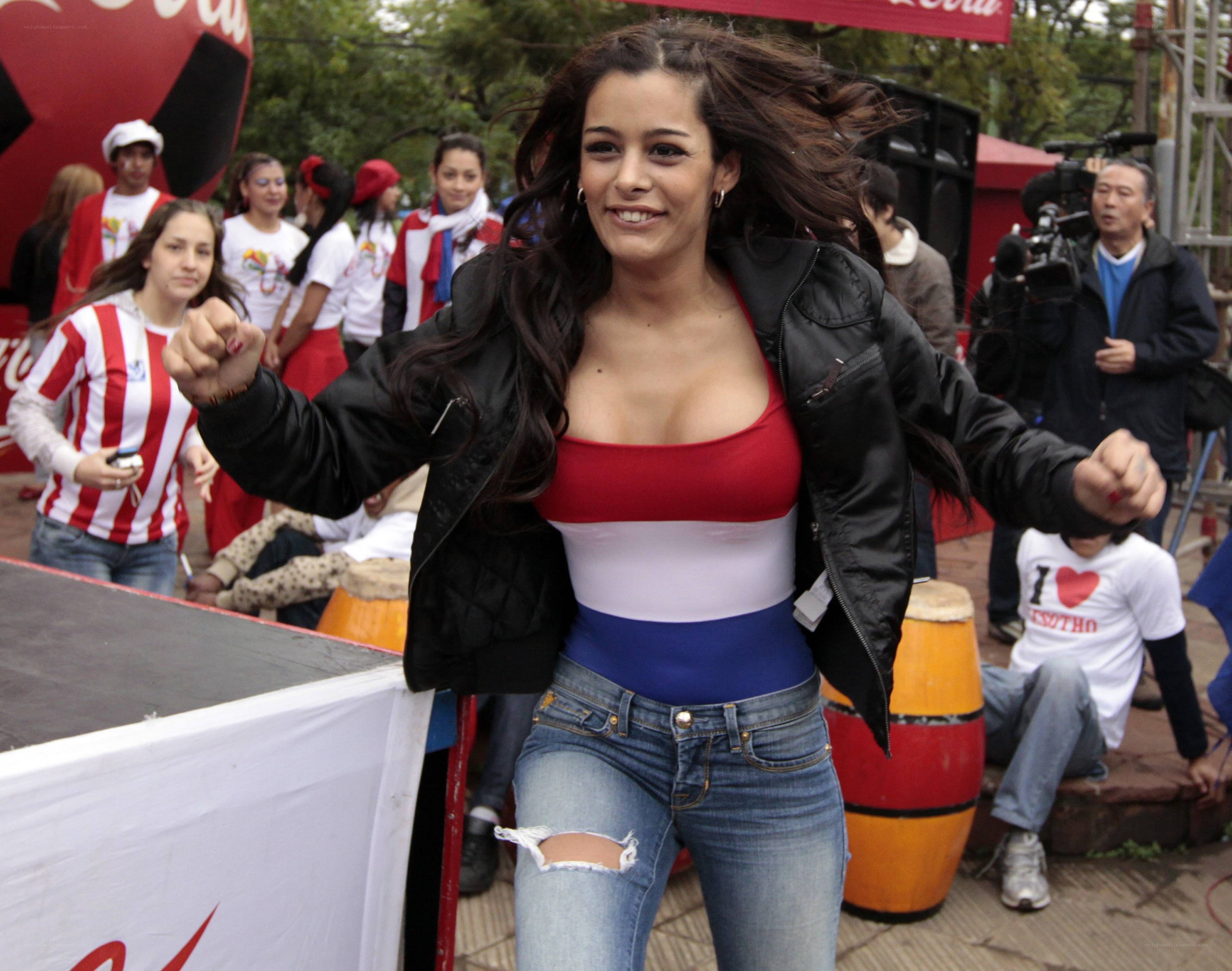 Woman in flag-themed top dancing