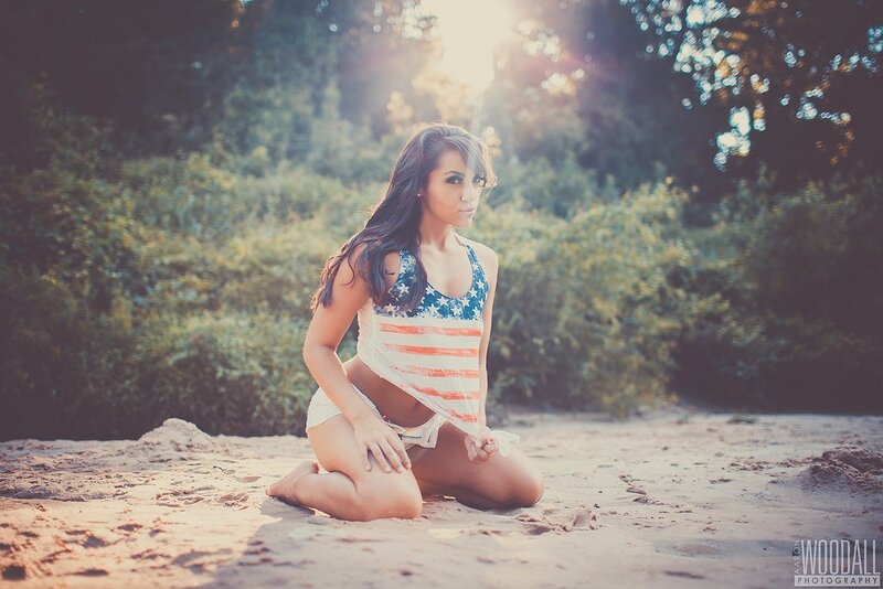 woman in flag-themed top on beach