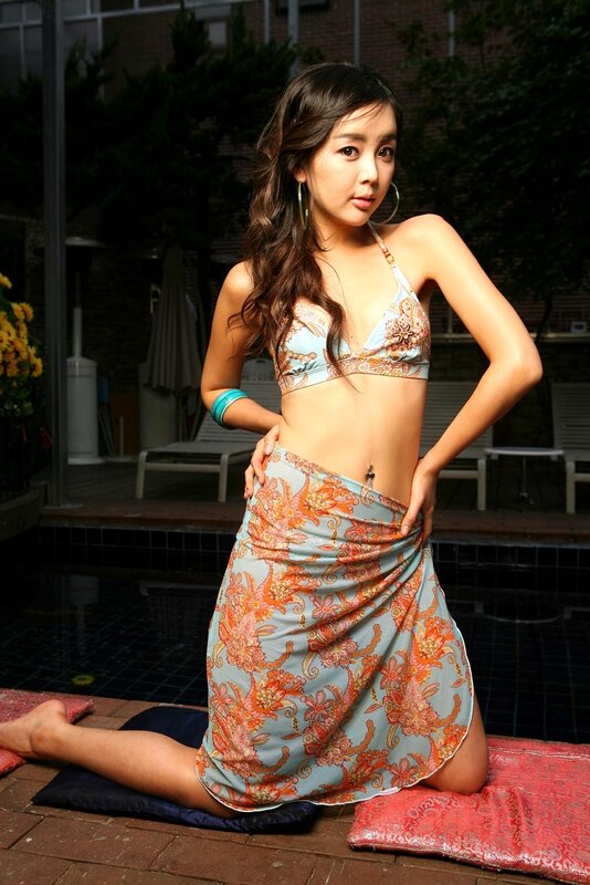 woman in floral bikini by pool