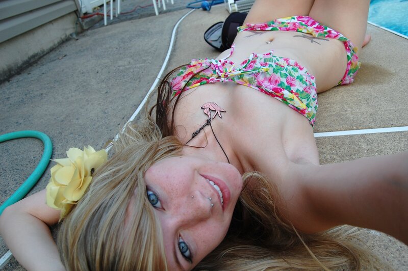 Woman in floral bikini by pool
