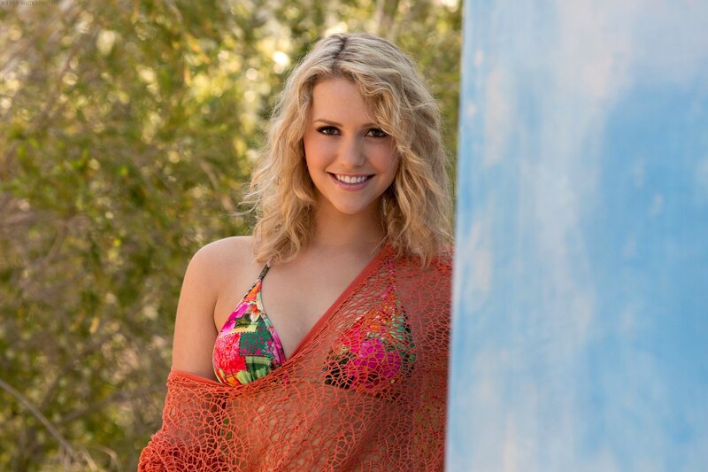 woman in floral bikini smiling