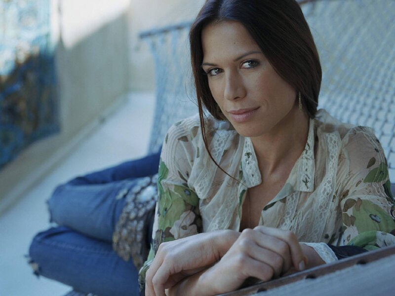 woman in floral blouse sitting
