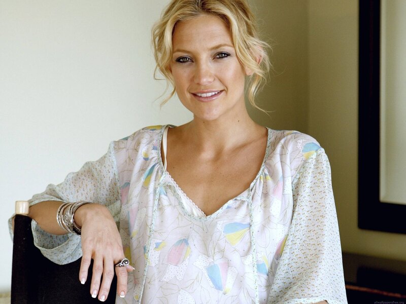 woman in floral blouse smiling