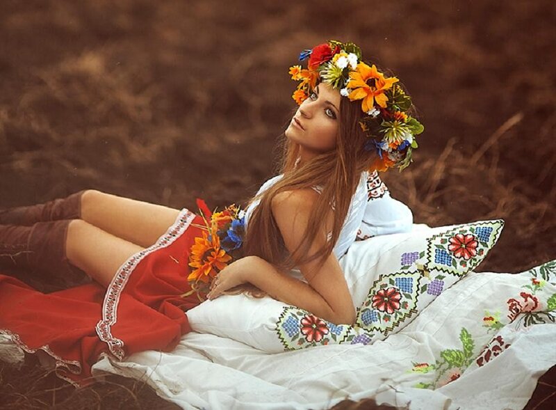 woman in floral crown lying down