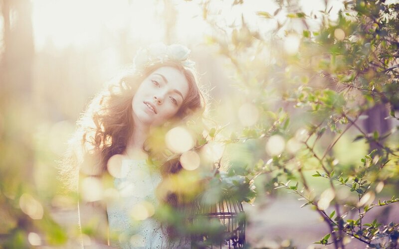 woman in floral crown with sunlight