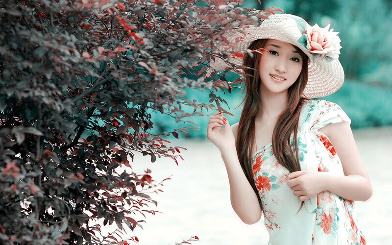 woman in floral dress and hat