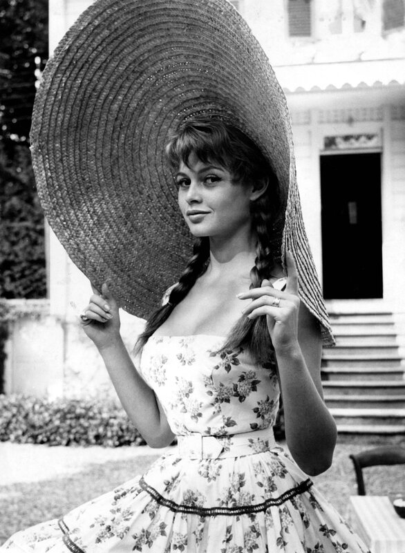 Woman in floral dress and hat