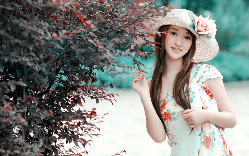 woman in floral dress and hat