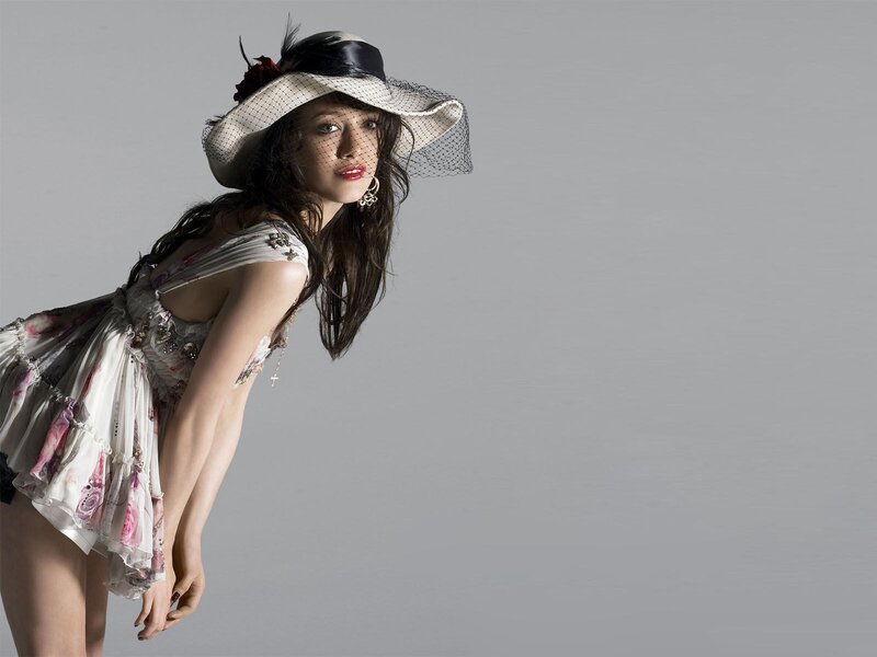 woman in floral dress and hat