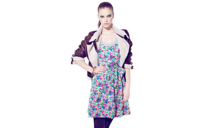 woman in floral dress and jacket