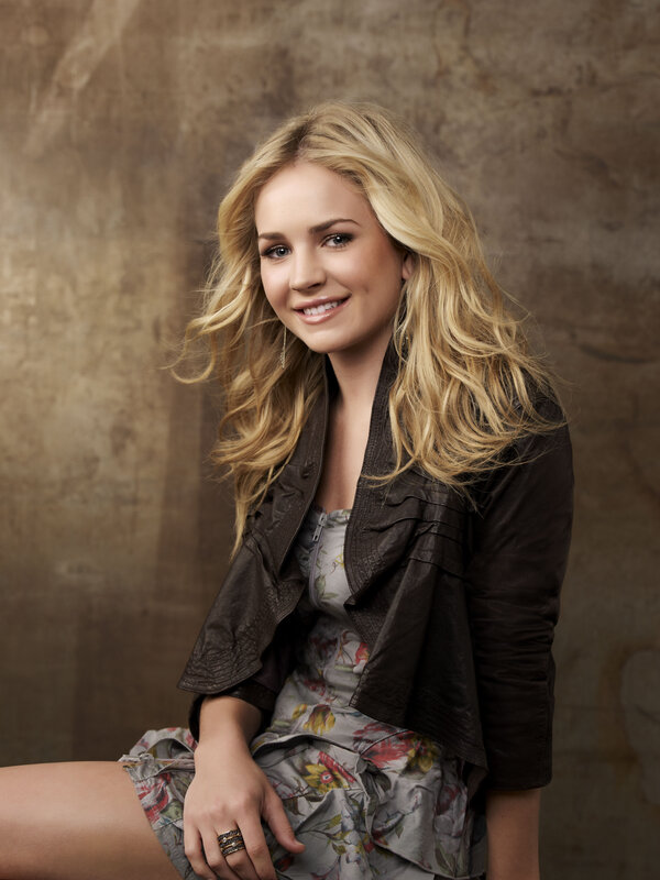 woman in floral dress and leather jacket