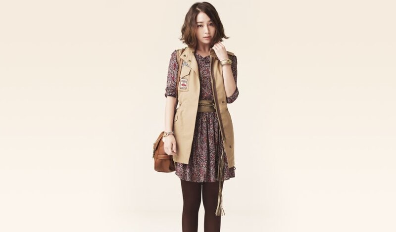 woman in floral dress and vest