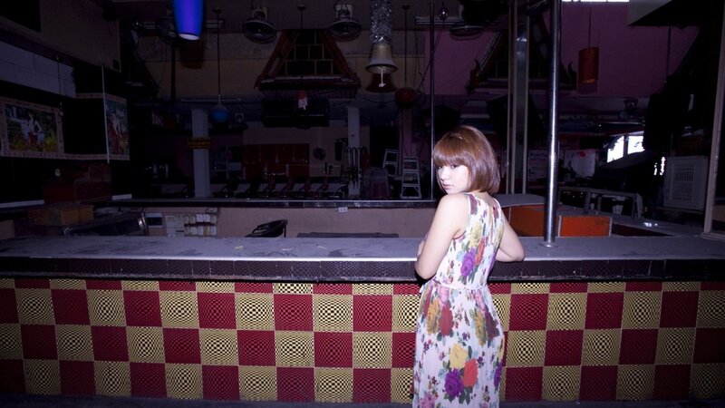 woman in floral dress at bar