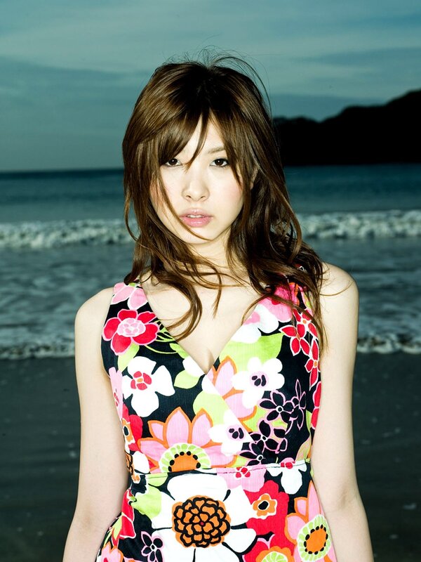 woman in floral dress at beach