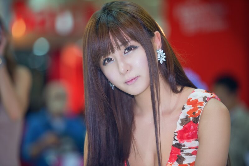 woman in floral dress at event