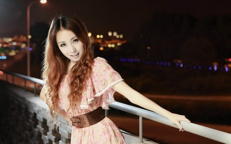 woman in floral dress at night