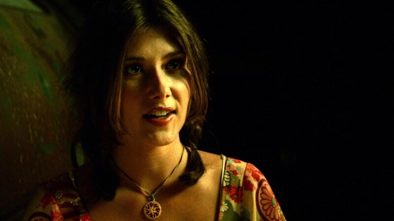 woman in floral dress at night