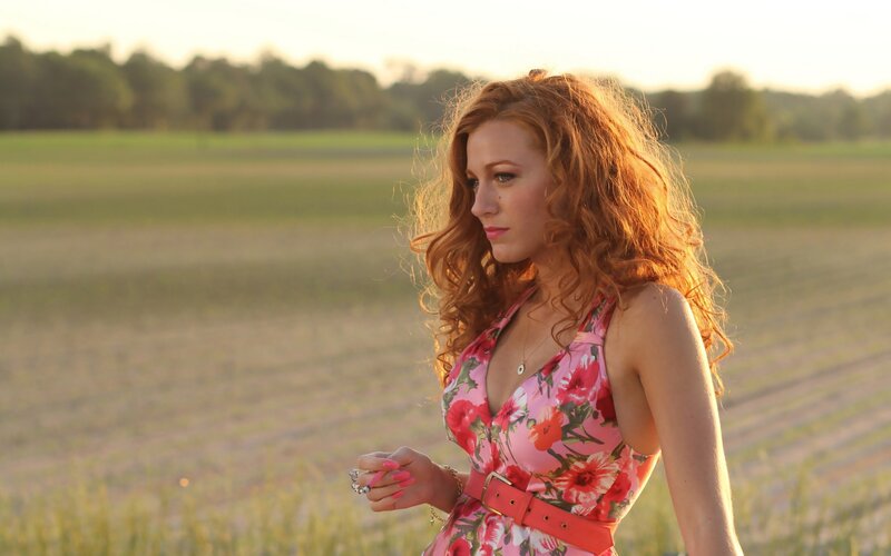 woman in floral dress at sunset