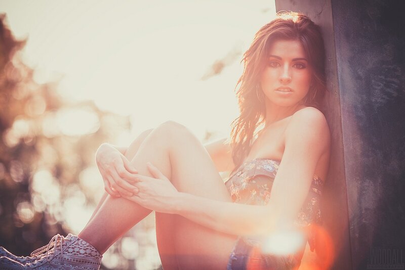 woman in floral dress at sunset