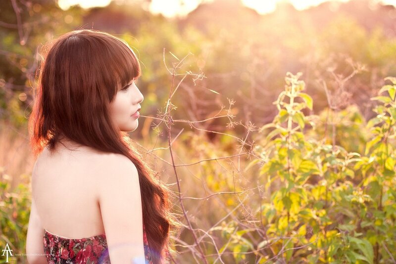 woman in floral dress at sunset
