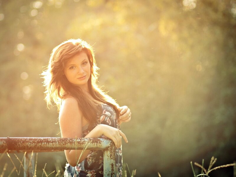 woman in floral dress at sunset