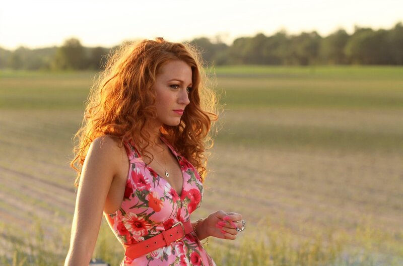 woman in floral dress at sunset