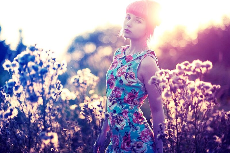 woman in floral dress at sunset