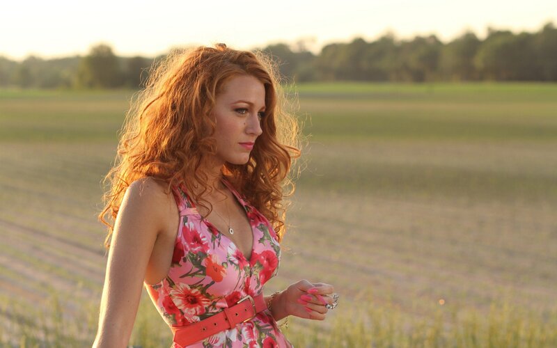 woman in floral dress at sunset