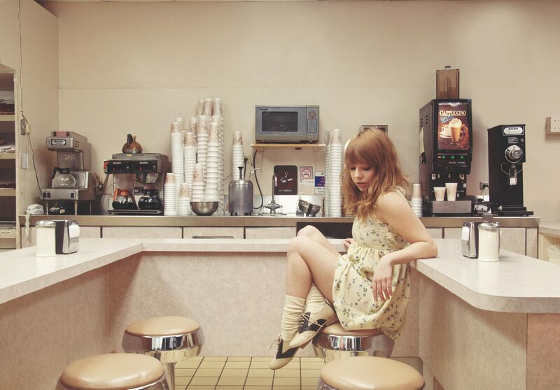 Woman in Floral Dress — Beige, Calm, Photograph, Coffee Shop