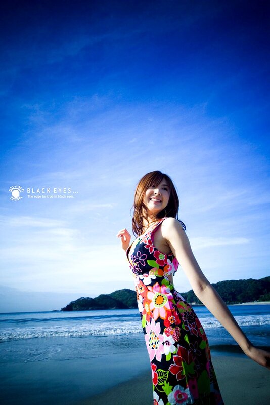 Woman in Floral Dress — Blue, Serene, Afternoon, Photograph, Beach, Ocean, Hills