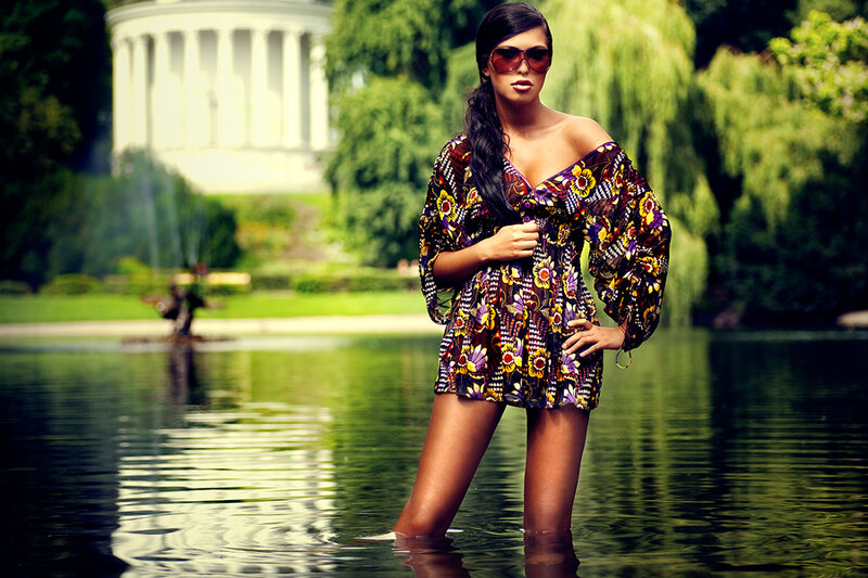 Woman in floral dress by water