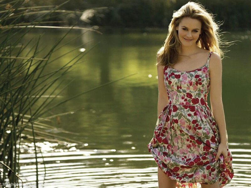 woman in floral dress by water