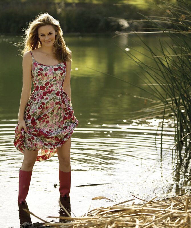 woman in floral dress by water