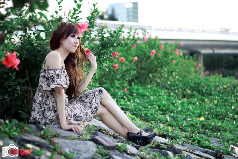 Woman in Floral Dress — Green, Serene, Afternoon, Photograph, Flowers, Greenery, Bridge