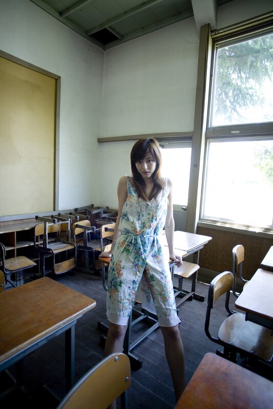 Woman in floral dress in classroom