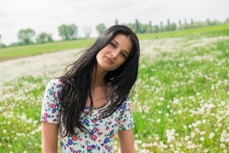 woman in floral dress in field