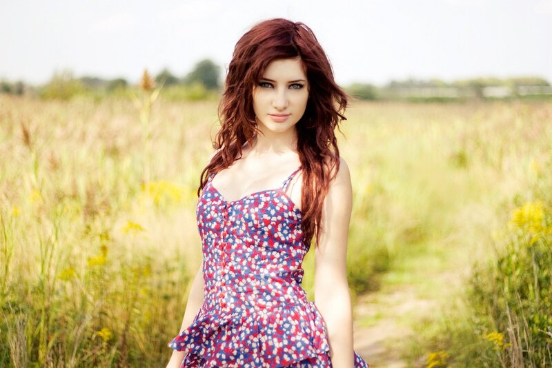 woman in floral dress in field