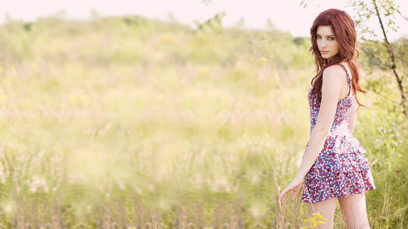 woman in floral dress in field
