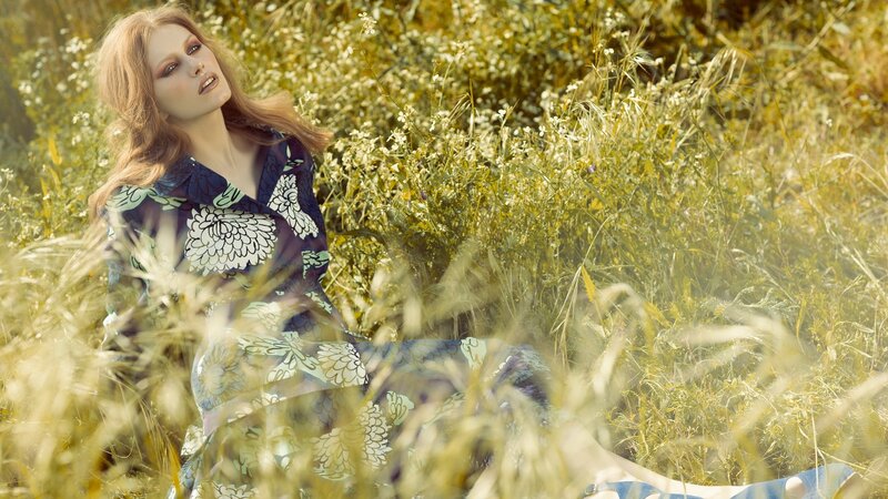 woman in floral dress in field