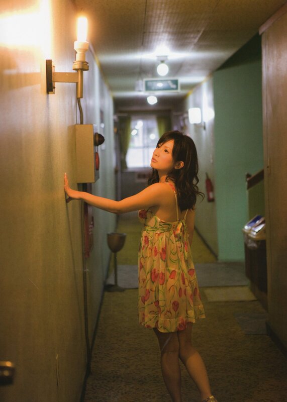Woman in floral dress in hallway
