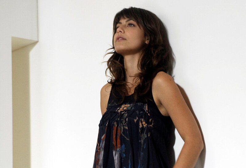 woman in floral dress leaning