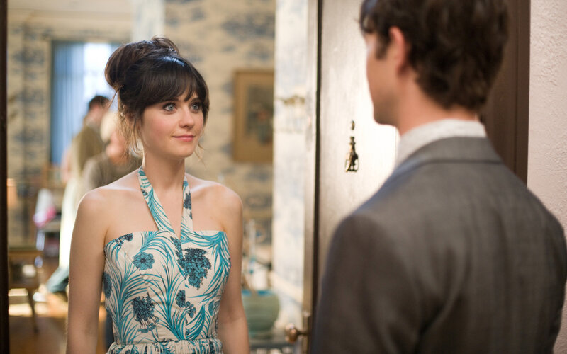 woman in floral dress looking at man